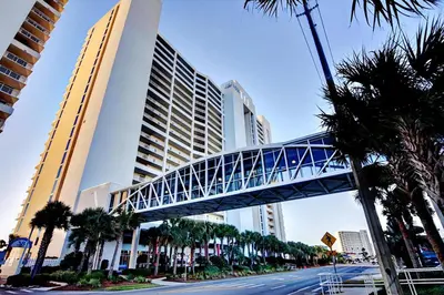 a bridge over a street in front of a building at Majestic Beach Towers 1-1006 in Panama City Beach