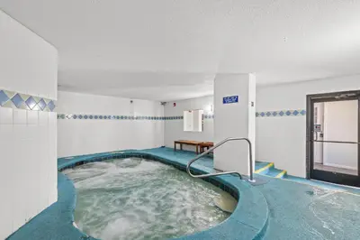 a jacuzzi tub in a swimming pool in a building at The Summit Beach Resort By Panhandle Getaways in Panama City Beach