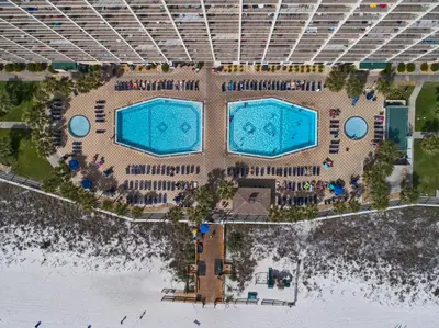 an overhead view of two pools at a resort at The Summit Beach Resort By Panhandle Getaways in Panama City Beach