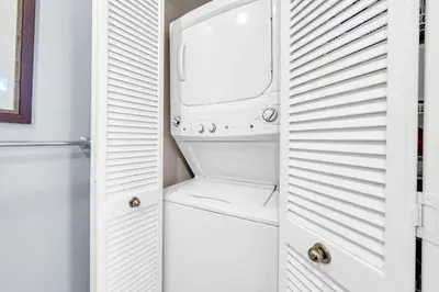 a white washer and dryer in a bathroom at Blue Sky Bungalow 156 in Seagrove Beach