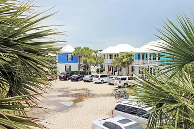 a group of cars parked in a parking lot at Blue Sky Bungalow 156 in Seagrove Beach
