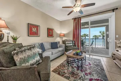 a living room with a couch and a table at Grand Panama 1-303 in Panama City Beach