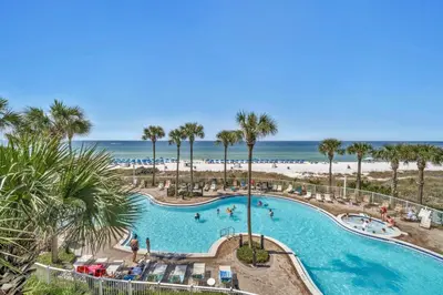an overhead view of a swimming pool with the beach at Grand Panama 1-303 in Panama City Beach