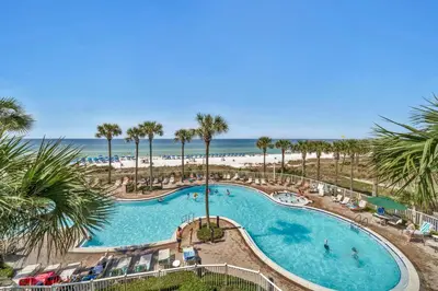 an overhead view of a swimming pool with the beach at Grand Panama 1-303 in Panama City Beach