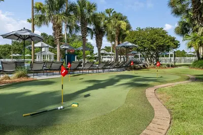 a golf course with chairs and a putting green at Marriott's Legends Edge at Bay Point in Panama City Beach