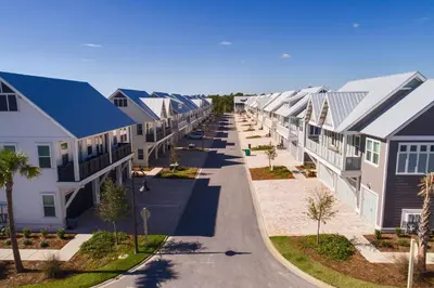 a row of houses on a street at Prominence on 30A by Panhandle Getaways in Watersound Beach