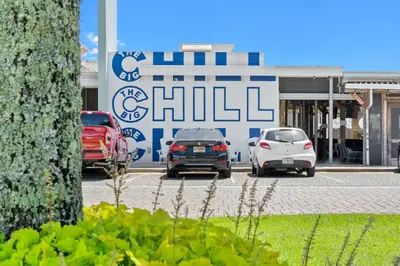 three cars parked in a parking lot in front of a building at Prominence on 30A by Panhandle Getaways in Watersound Beach