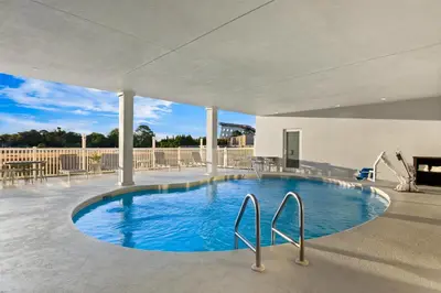 a large swimming pool in the middle of a building at Spark by Hilton Panama City Beach in Panama City Beach