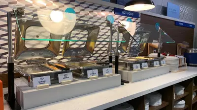 a store display of food items on a counter at Holiday Inn Express & Suites Panama City Beach - Beachfront by IHG in Panama City Beach