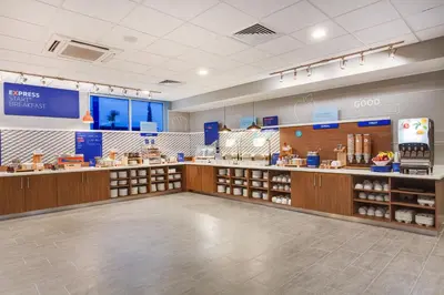 a grocery store with a cashier counter in a store at Holiday Inn Express & Suites Panama City Beach - Beachfront by IHG in Panama City Beach