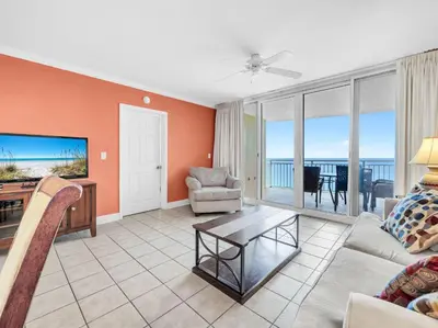 a living room with a view of the ocean at Emerald Beach 2225 in Panama City Beach