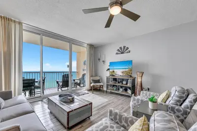 a living room with a couch and a ceiling fan at Majestic Beach Towers 2-2003 in Panama City Beach