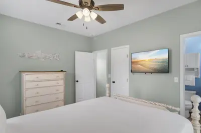 a bedroom with a white bed and a ceiling fan at The Bungalows at Seagrove 114 in Seagrove Beach
