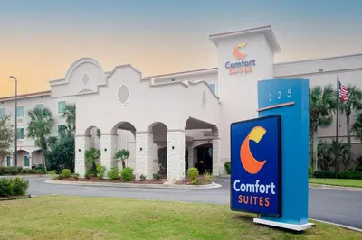 a sign in front of a building with a c comfort suites at Comfort Suites in Panama City Beach