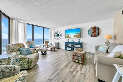 a living room with a couch and chairs at Edgewater Tower 2-611 in Panama City Beach