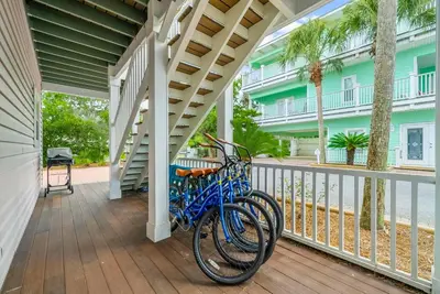 a bike is parked on the porch of a house at 30A Beach House - Sanibel in Seagrove Beach