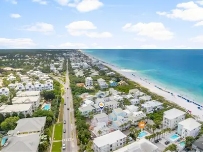 an aerial view of a beach with buildings and the ocean at 30A Beach House - Sanibel in Seagrove Beach