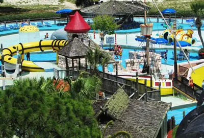 a water park with a water slide and a pirate ship at Ocean Reef 1708 in Panama City Beach