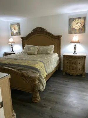 a bedroom with a large bed and two night stands at Edgewater Beautiful 2 bedroom 2 bath! in Panama City Beach