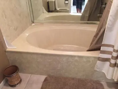 a bath tub in a bathroom with a shower at Edgewater Beautiful 2 bedroom 2 bath! in Panama City Beach