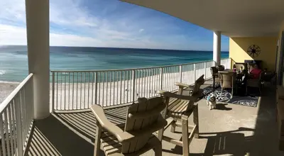 a balcony with chairs and a view of the ocean at Ocean Ritz - Family Tides - sleeps 12 in Panama City Beach