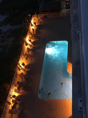 an overhead view of a swimming pool at night at Ocean Ritz - Family Tides - sleeps 12 in Panama City Beach
