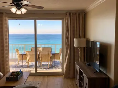 a living room with a view of the ocean at Ocean Ritz - Family Tides - sleeps 12 in Panama City Beach