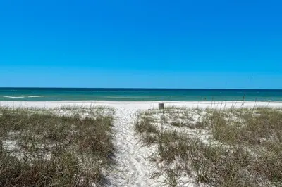a sandy beach with the ocean in the background at Sunnyside on the Gulf #3 in Sunnyside