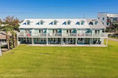 a large house with a lawn in front of it at Sunnyside on the Gulf #3 in Sunnyside