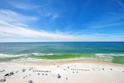 a group of people on a beach near the ocean at Majestic Beach Towers 1-1615 in Panama City Beach