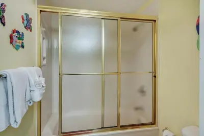 a shower with a glass door in a bathroom at Oceanfront Condo with Spacious Balcony - Unit 0306 in Panama City Beach