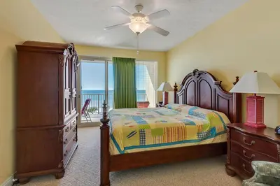 a bedroom with a bed and a dresser and a window at Oceanfront Condo with Spacious Balcony - Unit 0306 in Panama City Beach