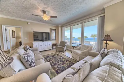 a living room with a couch and a tv at Beautiful Beachfront Condo with Pool View - Unit 0203 in Panama City Beach
