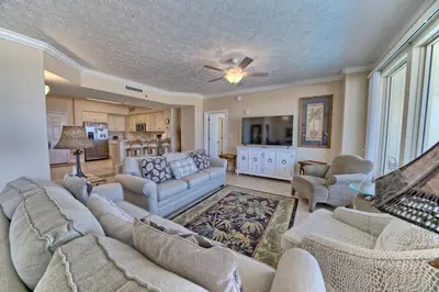 a living room with a couch and chairs and a tv at Beautiful Beachfront Condo with Pool View - Unit 0203 in Panama City Beach