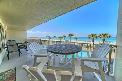 a table and chairs on a balcony with the beach at Beautiful Beachfront Condo with Pool View - Unit 0203 in Panama City Beach