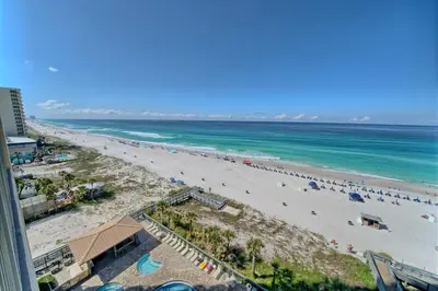 an aerial view of a beach with people in the water at Gorgeous Condo with Breathtaking Ocean View - Unit 0803 in Panama City Beach