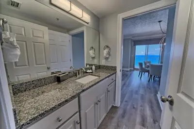 a bathroom with a sink and a large mirror at Gorgeous Condo with Breathtaking Ocean View - Unit 0803 in Panama City Beach