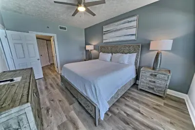 a bedroom with a bed and a ceiling fan at Gorgeous Condo with Breathtaking Ocean View - Unit 0803 in Panama City Beach