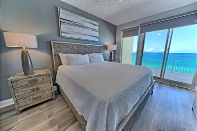 a bedroom with a bed with a view of the ocean at Gorgeous Condo with Breathtaking Ocean View - Unit 0803 in Panama City Beach