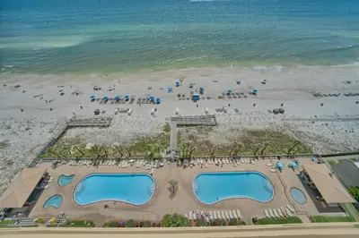 an overhead view of a beach with two swimming pools at Comfortable High-Rise Condo with Beach Access - Unit 1404 in Panama City Beach