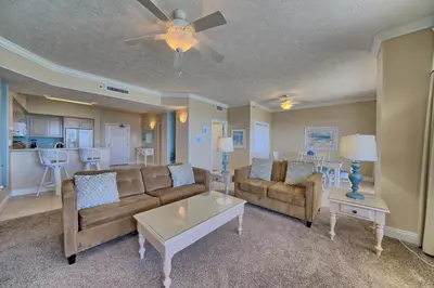 a living room with a couch and a table at Comfortable High-Rise Condo with Beach Access - Unit 1404 in Panama City Beach