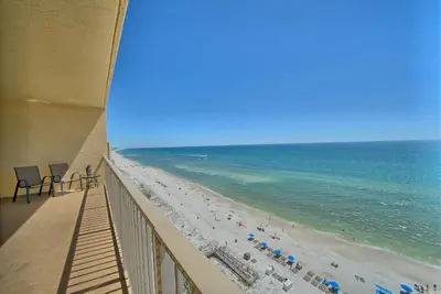 a view of the beach from a balcony at Comfortable High-Rise Condo with Beach Access - Unit 1404 in Panama City Beach