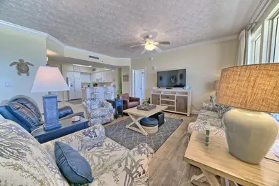 a living room with a couch and a table at Roomy Condo with Pool and Beach Access - Unit 0502 in Panama City Beach