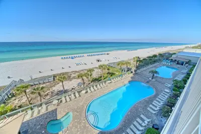 a view of the beach from the balcony of a resort at Roomy Condo with Pool and Beach Access - Unit 0502 in Panama City Beach