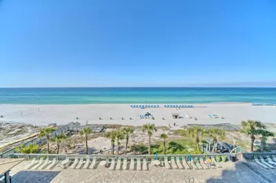 an aerial view of a beach with palm trees and the ocean at Roomy Condo with Pool and Beach Access - Unit 0502 in Panama City Beach