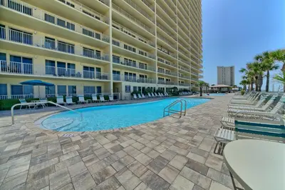 a swimming pool in front of a building at Luxurious High-Rise Condo with Spacious Balcony Facing the Ocean - Unit 1805 in Panama City Beach