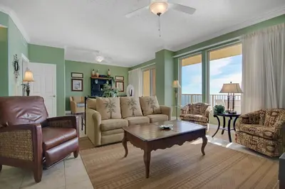 a living room with a couch and a table at Tropical High-Rise Condo with Beachside Pool Access and Free Poolside WiFi - Unit 2004 in Panama City Beach