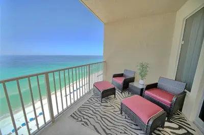 a balcony with chairs and a view of the beach at Stylish Oceanfront Condo with Beach and Picnic Area Access - Unit 1706 in Panama City Beach