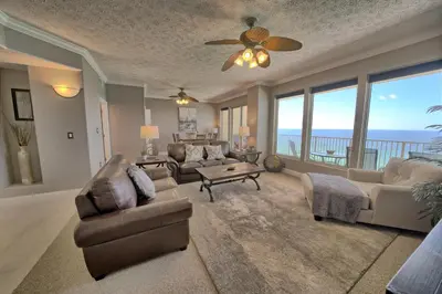 a living room with a view of the ocean at Stylish Oceanfront Condo with Beach and Picnic Area Access - Unit 1706 in Panama City Beach