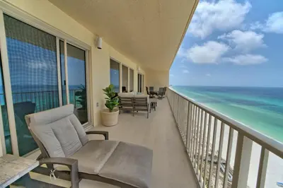 a balcony with chairs and a view of the ocean at Pleasant Oceanfront Condo with Large Balcony and Beach Access - Unit 1605 in Panama City Beach